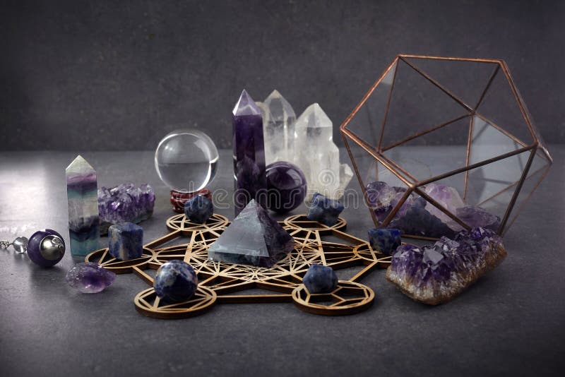 Crystal points and amethyst cluster on a dark background